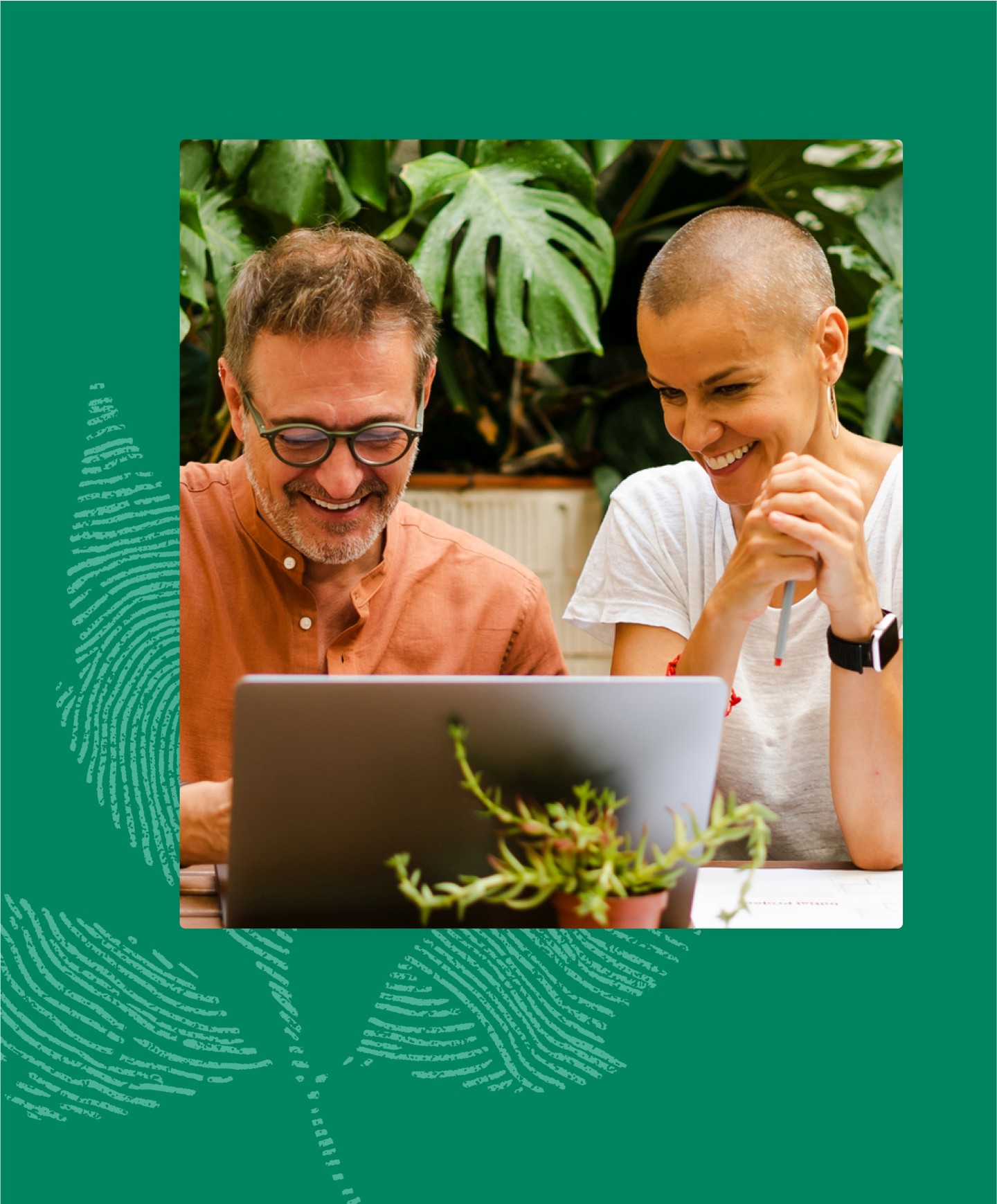 Two happy colleagues collaborting on laptop outside