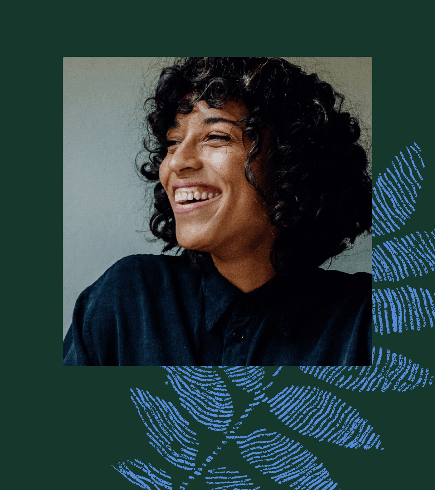 Photo of smiling Black woman in a navy shirt